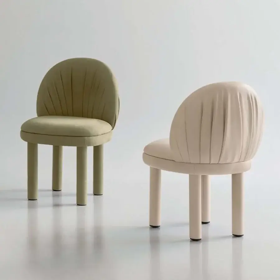 Sophisticated Rugiano Fandango chair with pale green leather upholstery and matte finish detailing vertical pleats