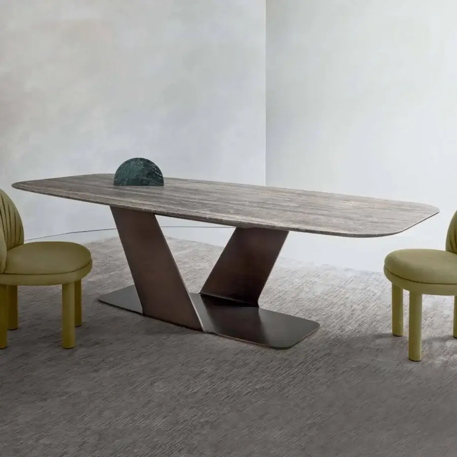 Exceptional Rugiano Wally table crafted in Italy with varnished bronze base and decorated painted wood top exhibiting a striated grain pattern