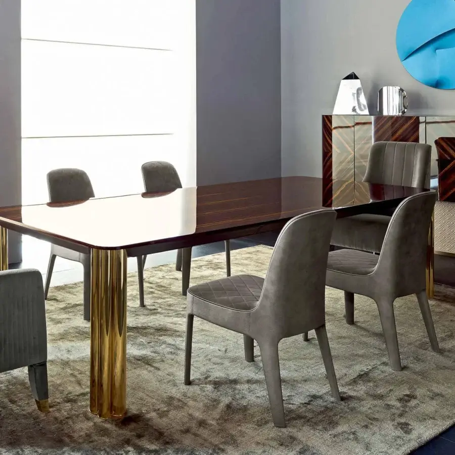 Distinguished Rugiano Forest table crafted with a dark glossy wood surface and lighter edges with golden welded tubes