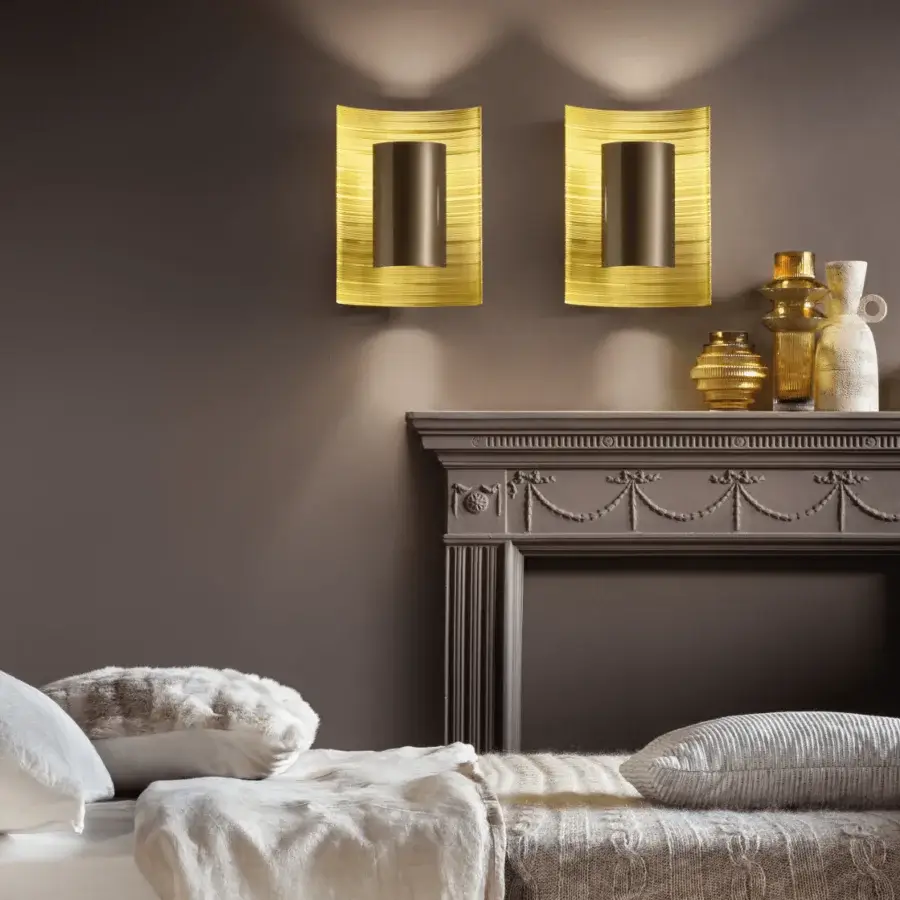 Exceptional Masiero Ebe wall lamp crafted in Italy with metal and brass wire mesh in gold tone and bronze light diffuser
