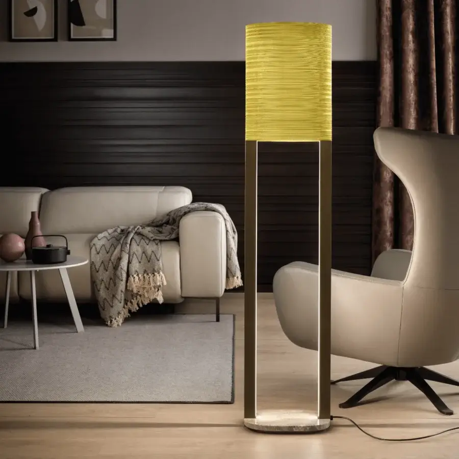 Elegant Masiero Ebe floor lamp with metal structure and onyx stone base, showcasing a yellow fabric lampshade crafted in Italy