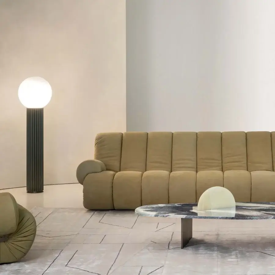 Distinctive Rugiano Snake sofa with padded structure fully upholstered in light brown fabric and rounded armrests