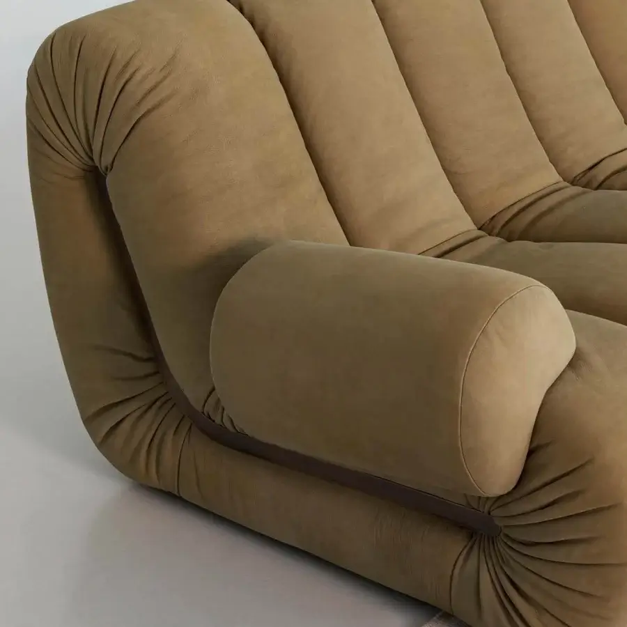 Elegant Rugiano Snake sofa with pillowed curves wholly upholstered in muted olive green fabric with matte finish