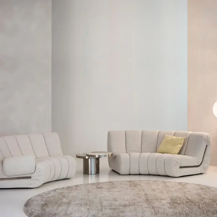 Exclusive Rugiano Snake sectional upholstered in light textile with contrasting dark trim and vertical stitched channels