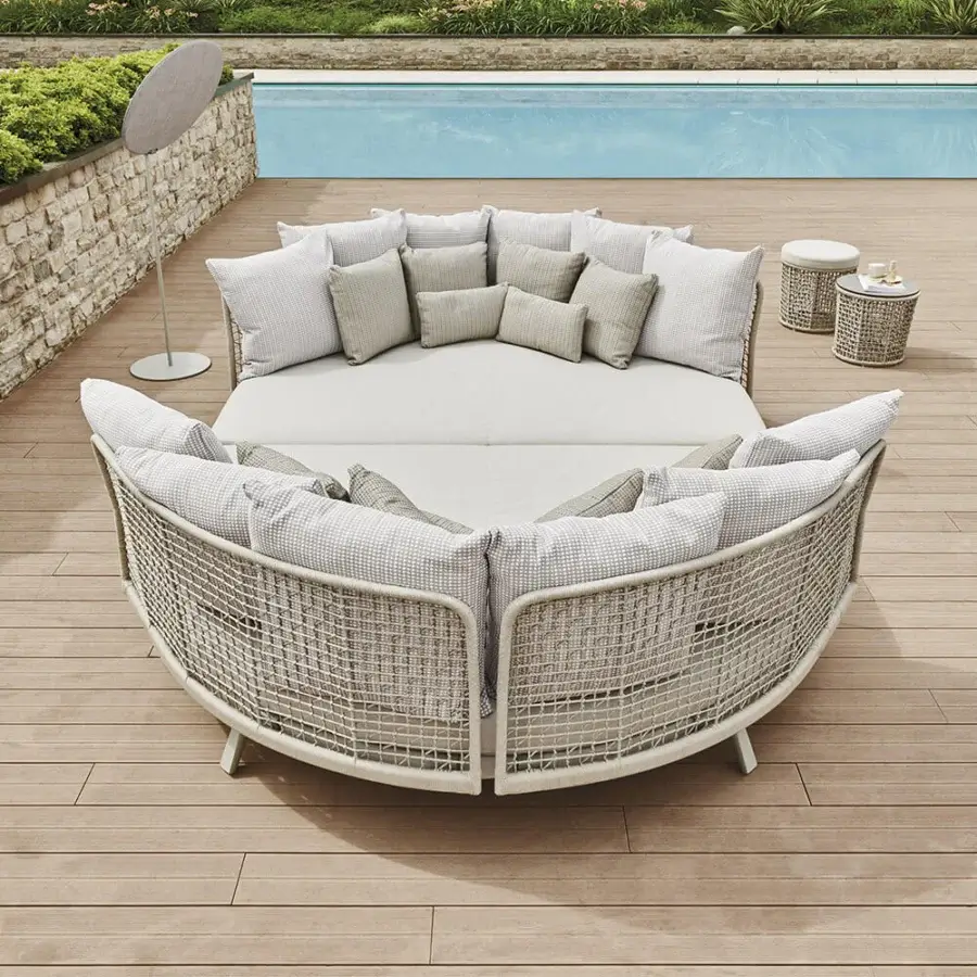 Distinctive Varaschin Emma daybed with woven light beige synthetic material and coordinating checkered cushions