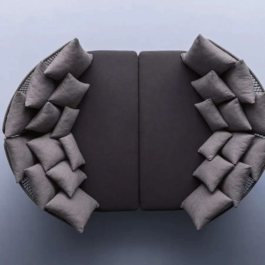 Handcrafted Varaschin Emma daybed with light gray subtly striped pillows and dark textile-covered base delivering a modern minimalist aesthetic