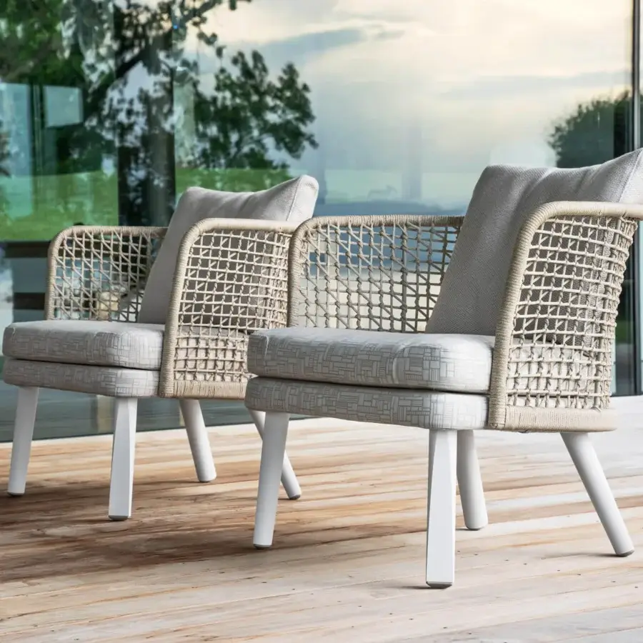 Lavish Varaschin Emma lounge chair with woven light beige backrest, plush light gray cushion and matte white legs