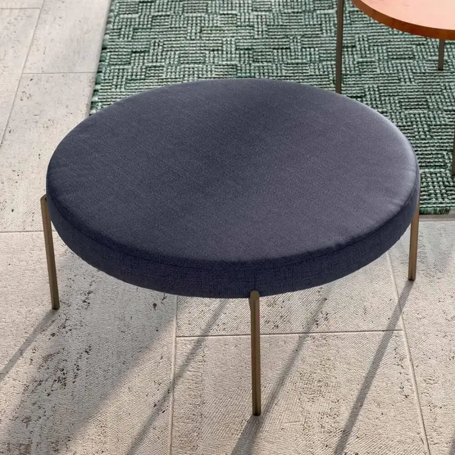 Superior Rugiano Apollo ottoman with comfortable dark blue fabric and bronze-finish metal legs