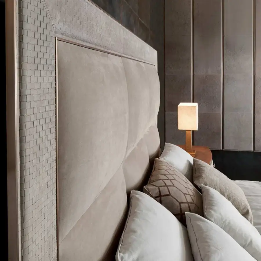 Superior Rugiano Aura bed upholstered in light brown textile with diamond segments and rose gold metallic frame with woven gray accents