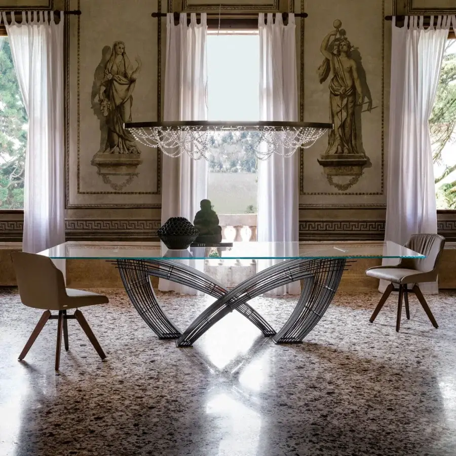 Distinguished Cattelan Italia Hystrix table with a clear glass top and interwoven dark metal base presenting a sculptured design
