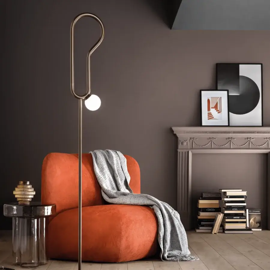 Elegant Masiero Visio floor lamp with a looping painted metal structure and Murano glass diffuser emitting soft light