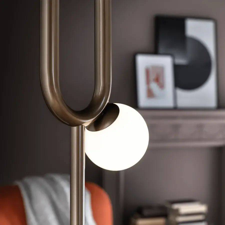 Superior Masiero Visio floor lamp with a curved metal frame and Murano glass diffuser in bronze tone