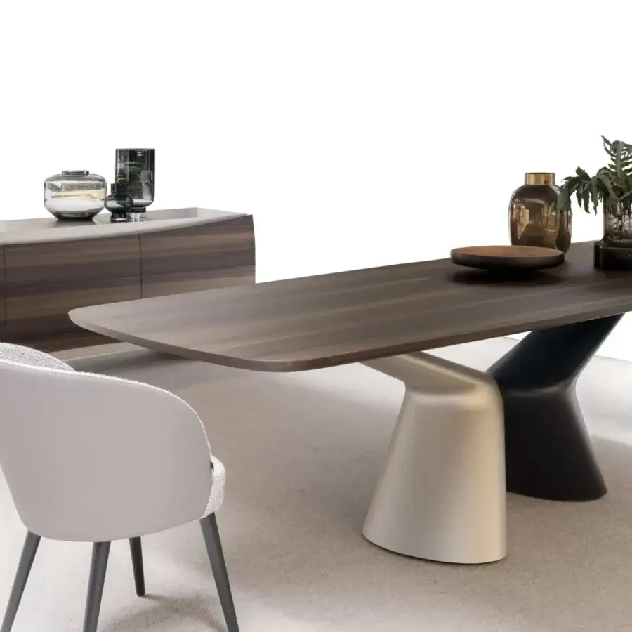 Distinguished Presotto Victor table with a large rounded dark brown tabletop and contoured legs in matte silver and dark hues