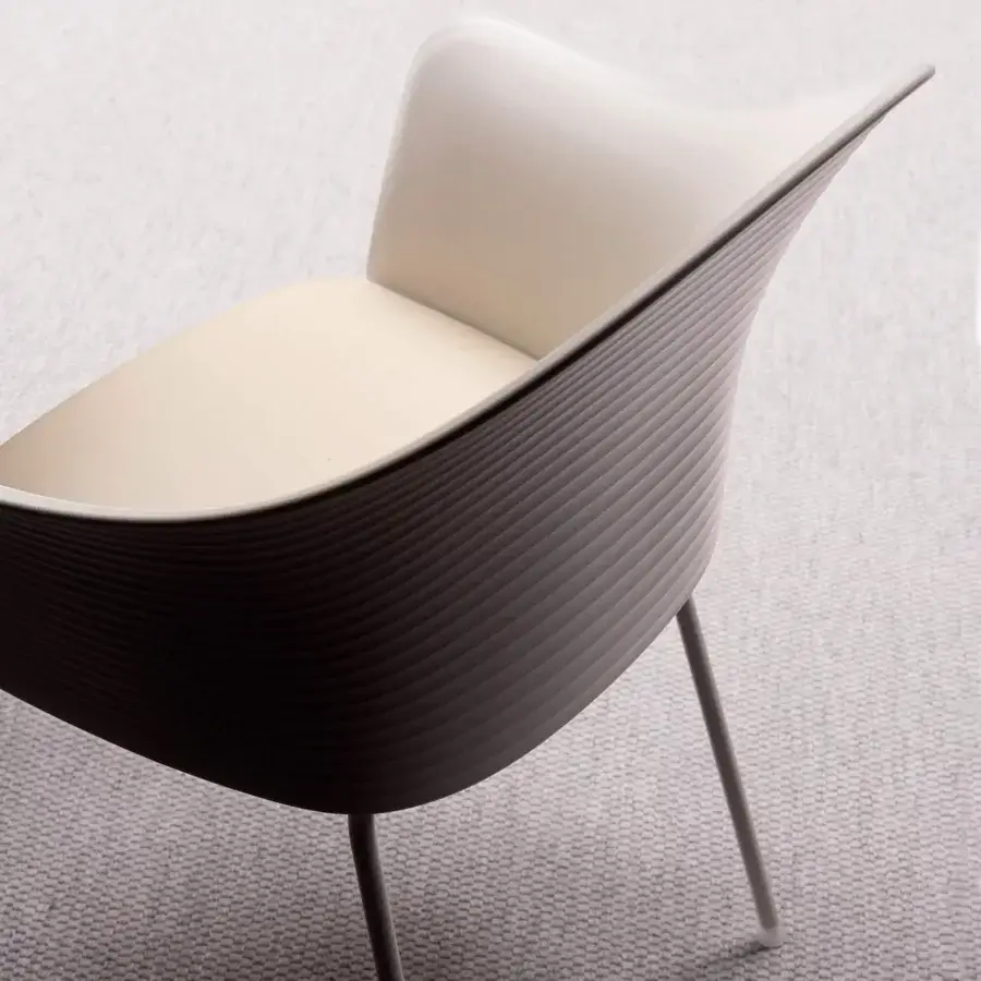 Sophisticated Presotto Profilo Tofane chair with curved form built in plastics and upholstery with slender metal legs