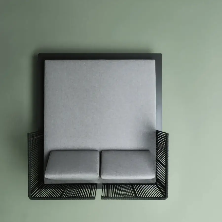 Sophisticated Varaschin Sunmoon lounger with woven dark exterior and light grey textured cushions in powder-coated aluminium