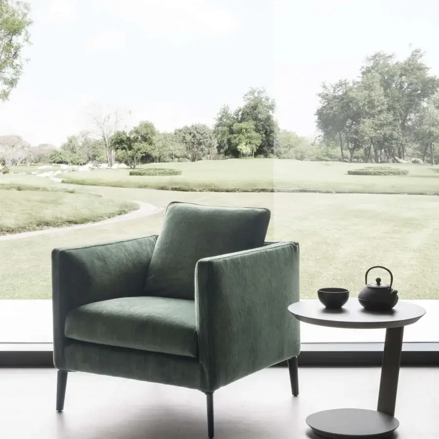 Exceptional Presotto Raffaello lounge chair built in muted green textile with a textured finish and slender metal legs