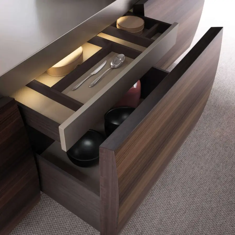 Distinctive Presotto Vele sideboard with curved fronts in Canaletto Walnut and smooth light gray top revealing an illuminated interior