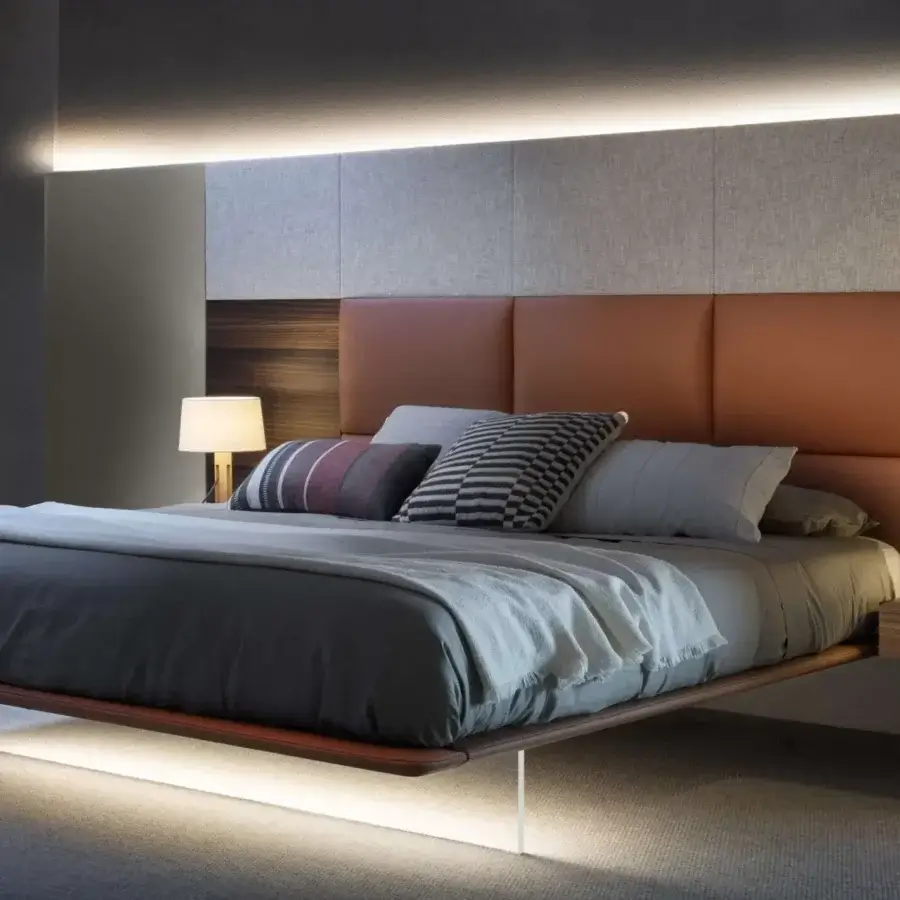 Superior Presotto Dama bed with quilted headboard in light brown leather and satin wood veneer accents with a visually floating methacrylate base