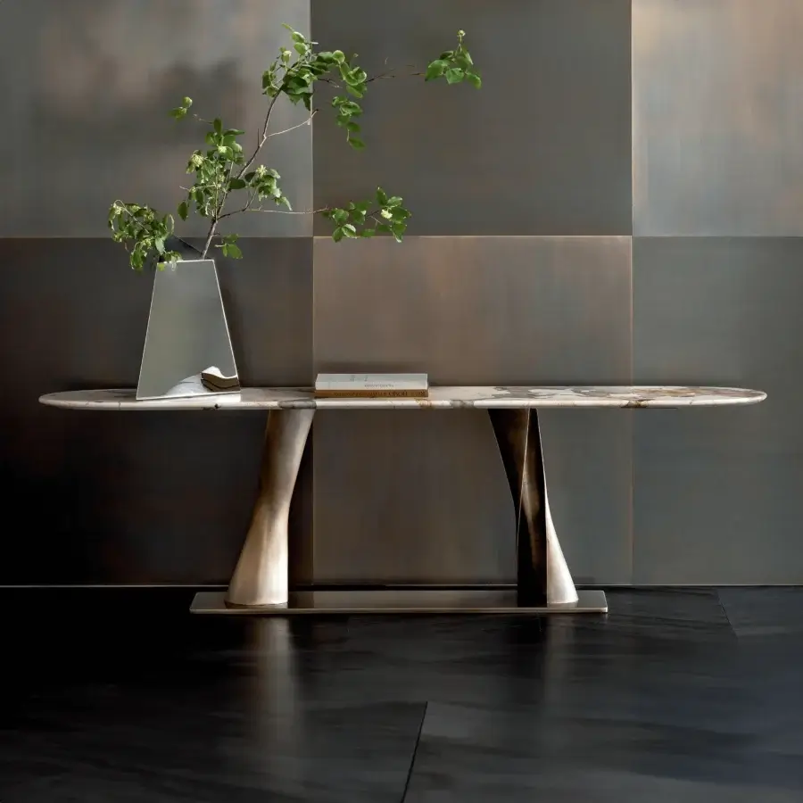 Impeccable Rugiano Rea console with light cream and gray marble tabletop supported by curved bronzed brass pedestal legs in satin finish