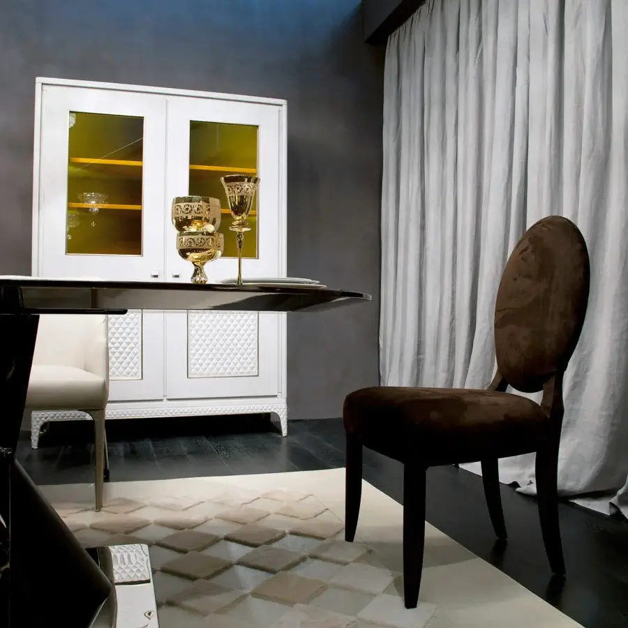 Exceptional Rugiano Rea table crafted in Italy with a glossy ebony top and uniquely shaped bronzed brass base