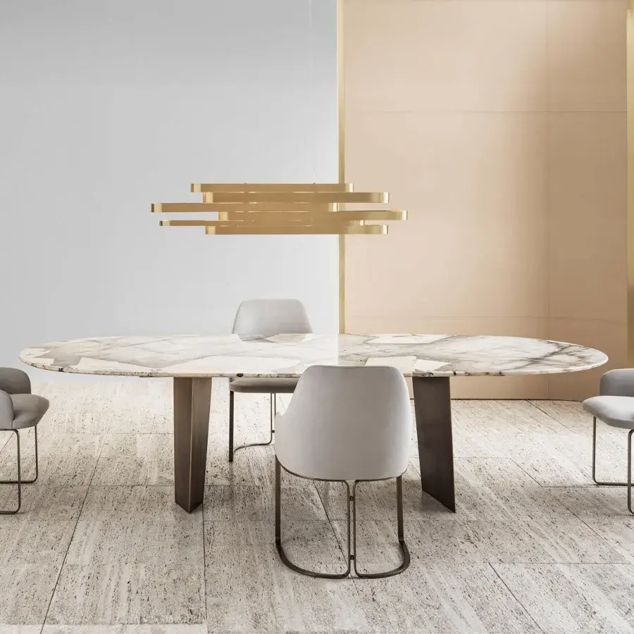 Exceptional Rugiano Pedro table with marbled oval top and matte bronzed brass pedestal legs