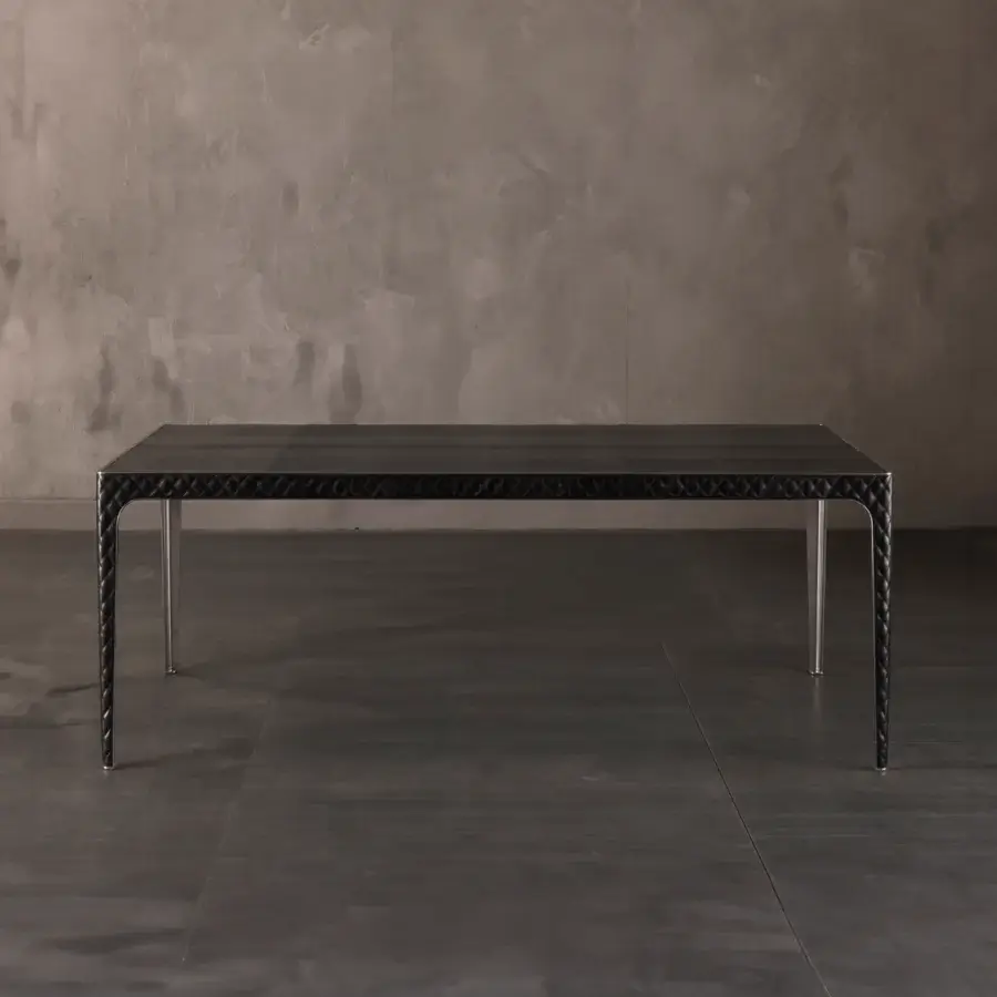 Distinguished Rugiano Alexander table with sleek dark top and shiny metal legs crafted in bronzed brass or chrome accents