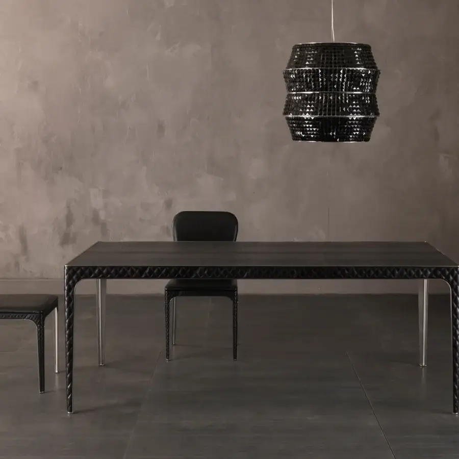 Superior Rugiano Alexander table with quilted dark leather top and sleek chrome legs