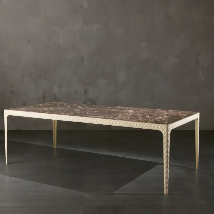 Exceptional Rugiano Alexander table with brown and beige veined marble and a light beige quilted synthetic frame