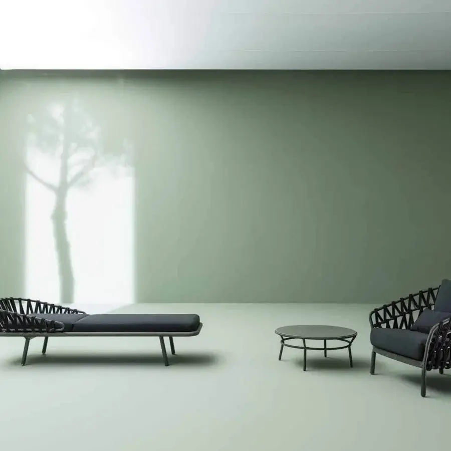 Superior Varaschin Emma Cross Lounger with dark woven backrest and powder-coated aluminum frame built with a plush cushion