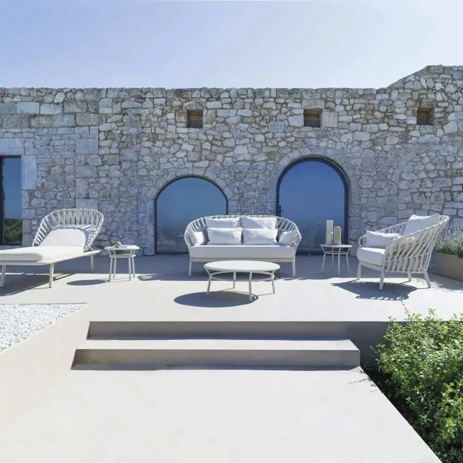 Superior Varaschin Emma Cross lounger with enveloping design and distinctive handmade woven synthetic material in off-white powder-coated aluminum finish