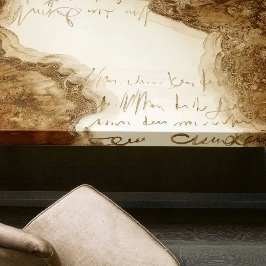 Distinguished Rugiano Decoro table with decoro painted wood displaying a marbled effect and cursive writing in brown shades with a dark metal base