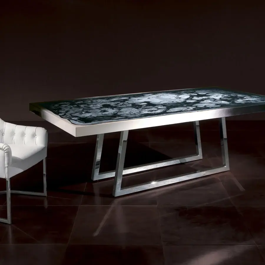 Distinguished Rugiano Decoro table crafted in Italy with decoro painted wood exhibiting marbled black, white and gray tones and polished chrome base