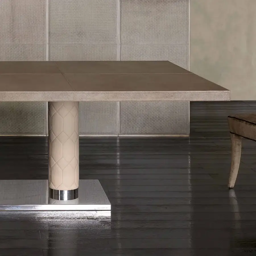 Superior Rugiano Fujico table with light brown leather tabletop and cylindrical embroidered leather legs built on a chrome base