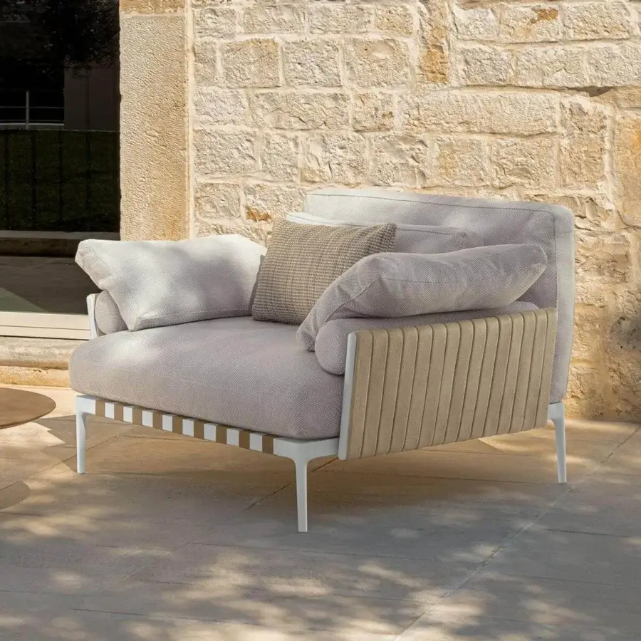 Distinctive Talenti Salinas lounge chair with light gray woven textile and padded beige ribbed straps in a white metal frame