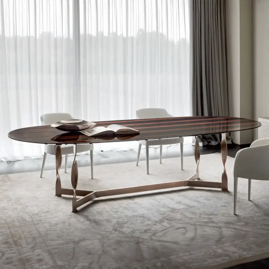 Distinguished Rugiano Pliet table with ebony wood top and bronzed brass base showcasing a twisted design and glossy finish