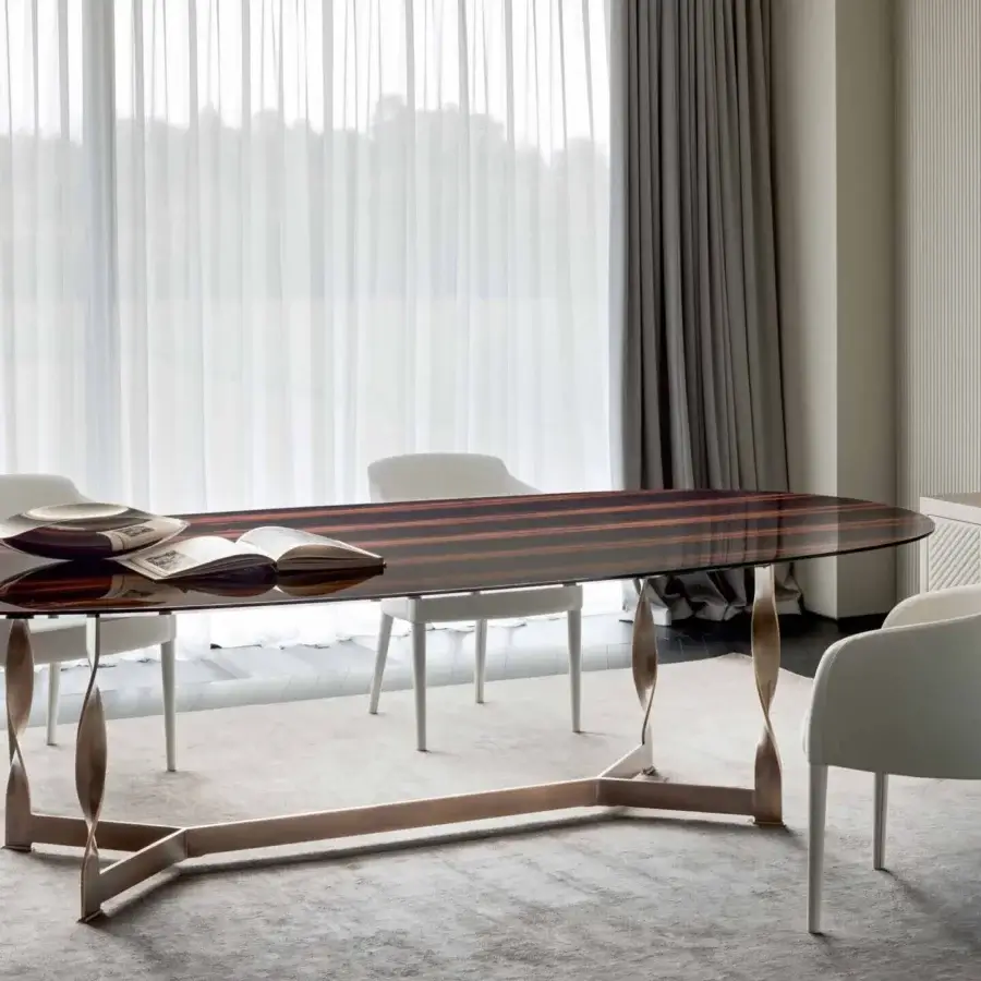 Exceptional Rugiano Pliet table with dark wood tabletop and glossy finish crafted in bronzed brass with a twisted leg design