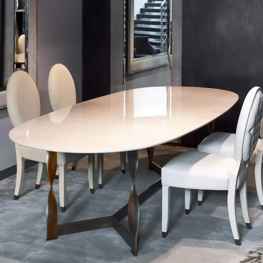 Distinguished Rugiano Pliet table with radiant chrome or bronzed brass base and a light-colored leather, ebony or oak wood top