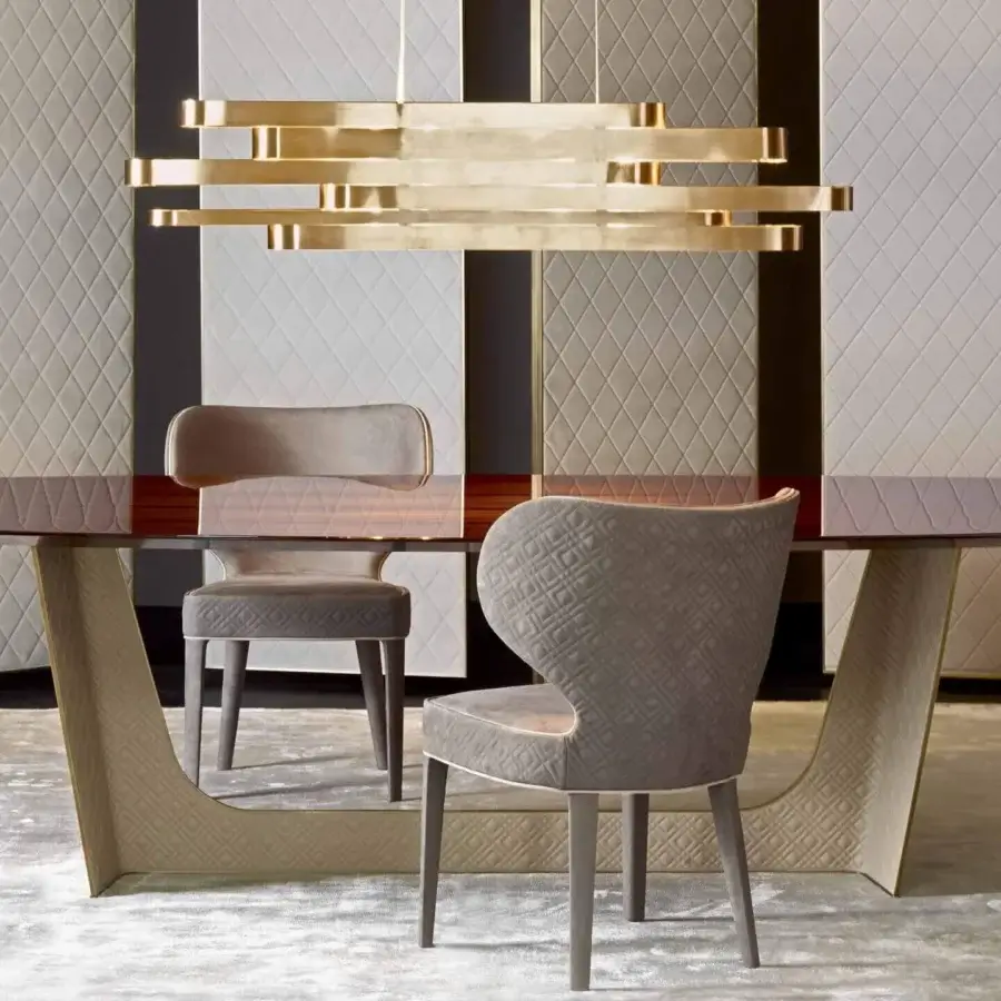 Lavish Rugiano Wings table crafted in Italy with reddish-brown wood, bronzed brass and quilted beige embroidered leather base