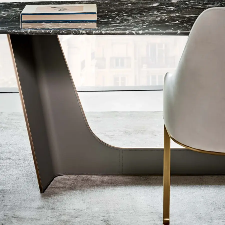 Exceptional Rugiano Wings table crafted in Italy with marble-like top and embroidered leather base with bronzed brass trim