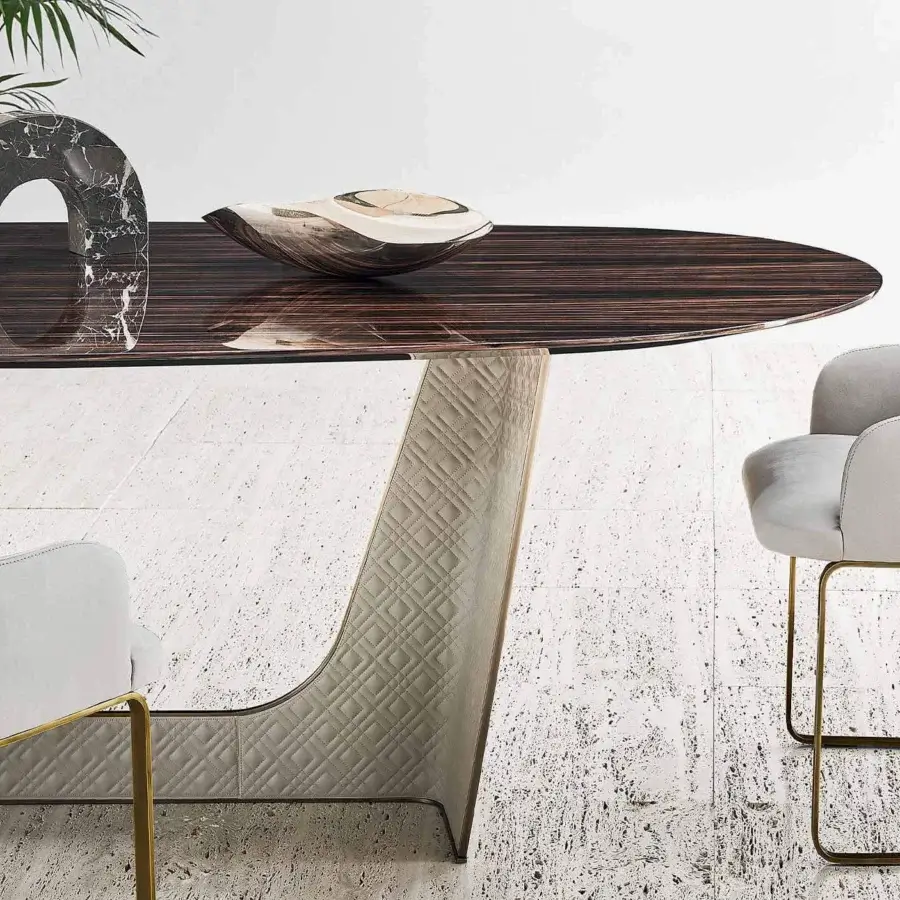 Distinguished Rugiano Wings table crafted in Italy with ebony top, bronzed brass and quilted light beige textile base