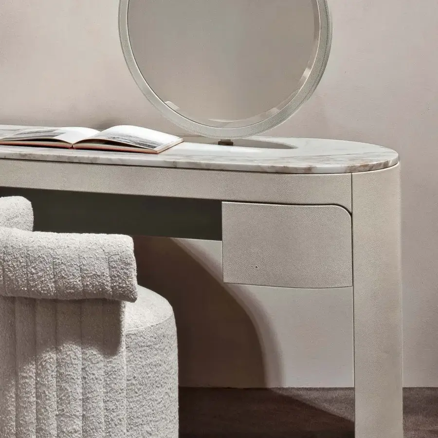 Exceptional Rugiano Vogue vanity with swirling marble-like top and matte light-gray textured material covering drawer and curved leg