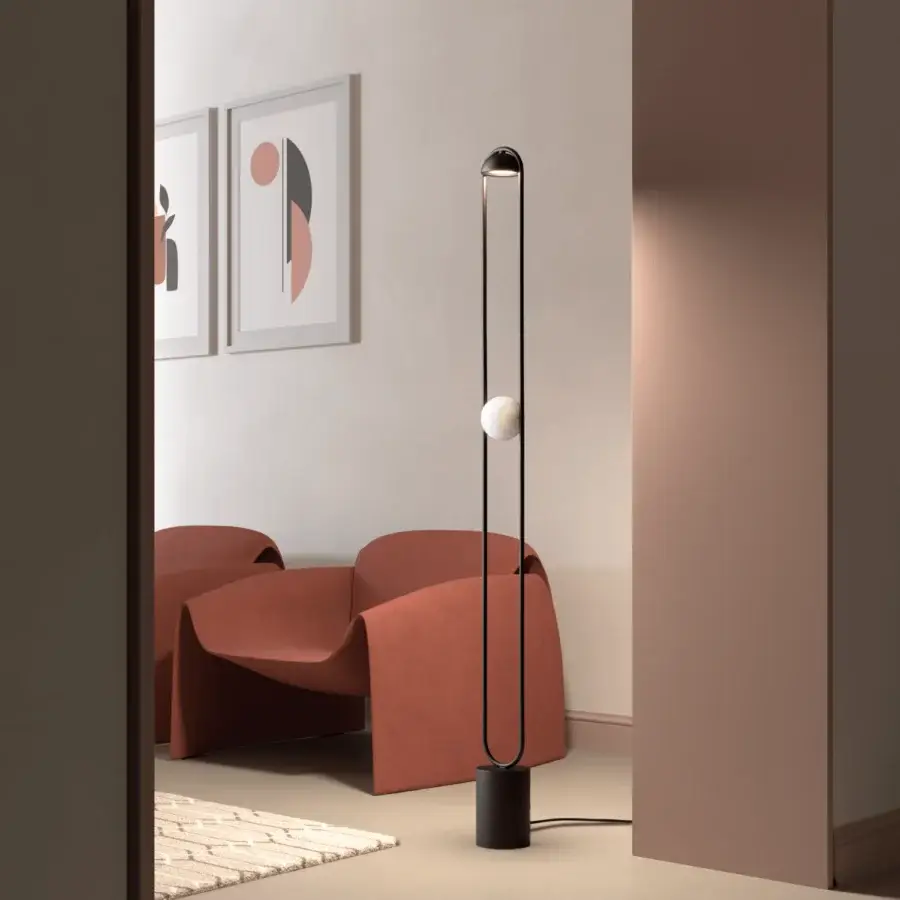 Elegant Masiero Luppiter floor lamp with slim metal structure and spherical white light element in matte black finish