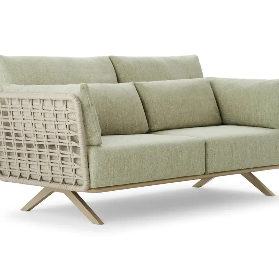 Exceptional Roberti Rànan sofa crafted with powder-coated stainless steel and aluminum, woven in natural Oval Trendyrope with inviting sage green cushions