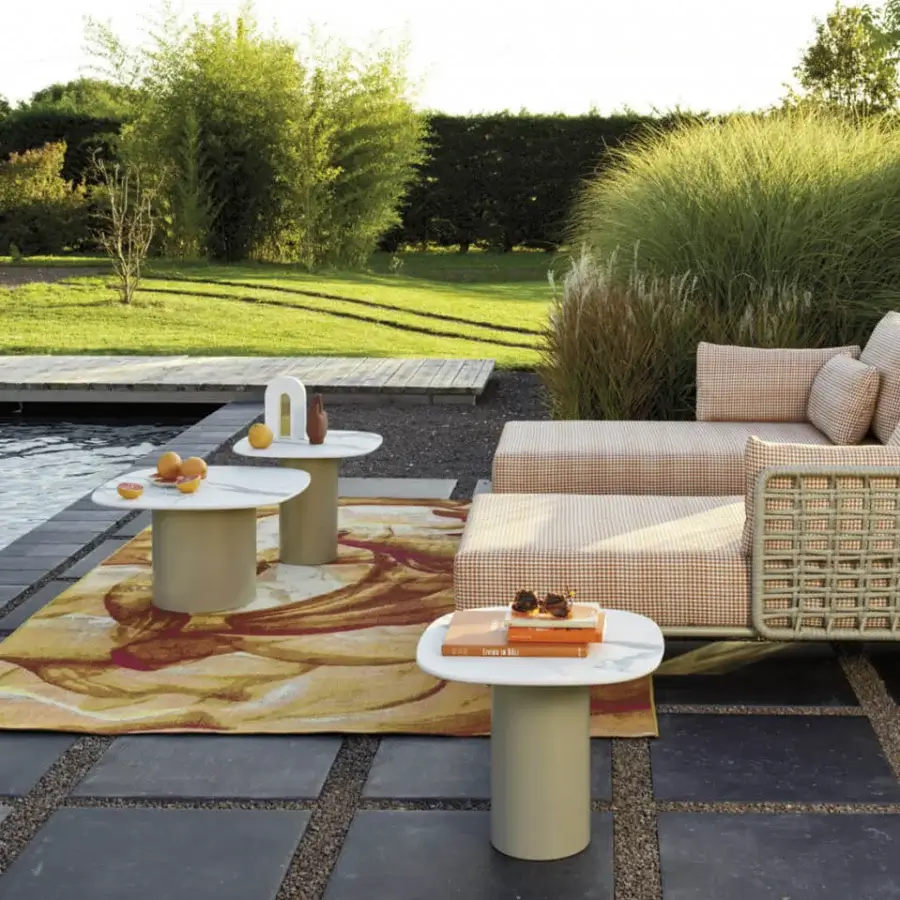 Distinguished Roberti Rattan Armàn coffee table crafted in Italy with a white marble effect tabletop and powder coated stainless steel base