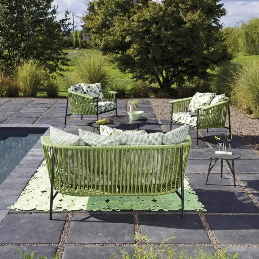 Distinguished Roberti Rattan Corolle lounge chair woven with light green Oval Trendyrope and powder-coated Aisi 304 stainless steel