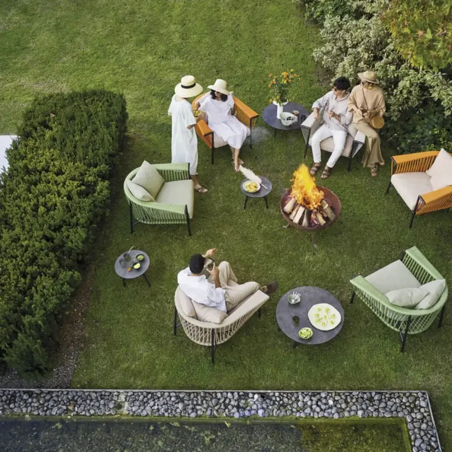 Exceptional Roberti Rattan Corolle lounge chair crafted in light green Oval Trendyrope with a powder-coated Aisi 304 stainless steel frame