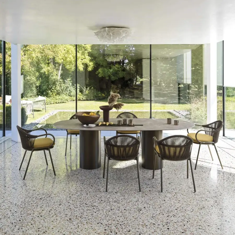 Exceptional Roberti Rattan armchair with yellow cushion and bronze-like powder-coated aluminum frame woven in Round Trendyrope