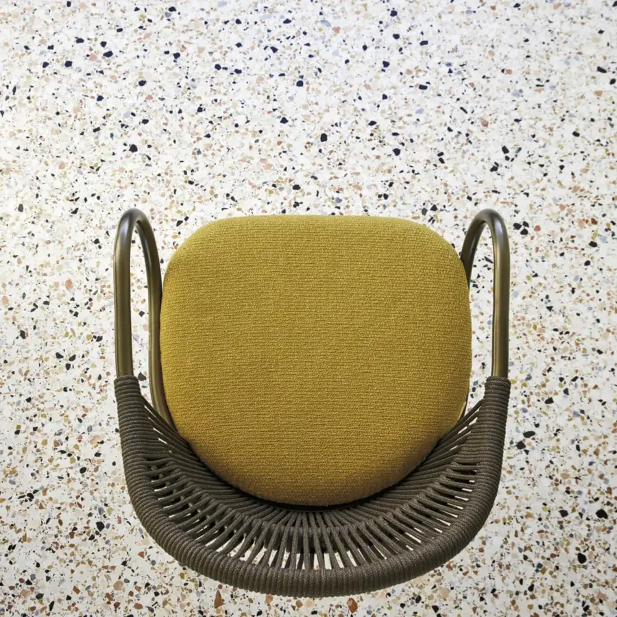 Exceptional Roberti Rattan armchair woven with Round Trendyrope in mustard-yellow textile and bronze powder-coated aluminum frame