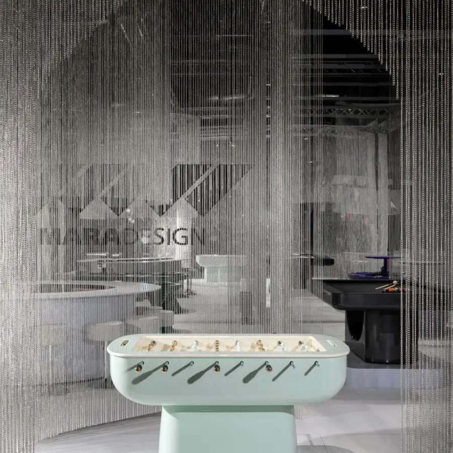 Stylish Vismara Oskar foosball table with light mint green lacquered structure and chromed steel rotating bars