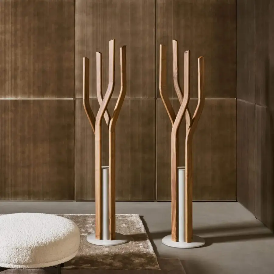 Elegant Bonaldo Alma coat stand with curving solid wood stems and light grey concrete base crafted with a warm natural finish